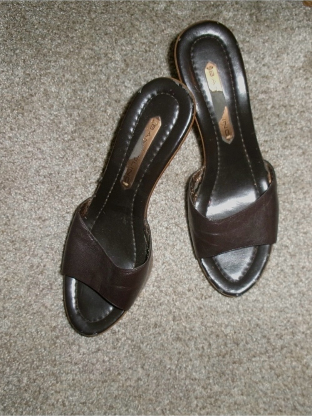 Bandolino Brown Leather Platform Mule Heels
With an Open Toe Slip-On